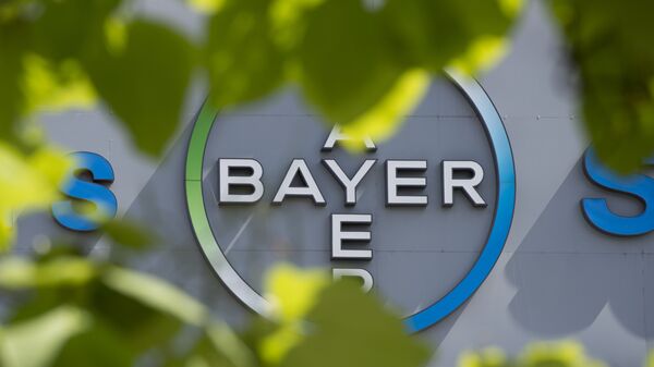 This file photo taken on July 24, 2013 shows a logo of German pharmaceuticals and chemicals giant Bayer on an overpass at its Berlin headquarters - Sputnik Afrique