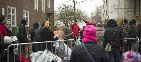 Des migrants à Berlin - Sputnik Afrique