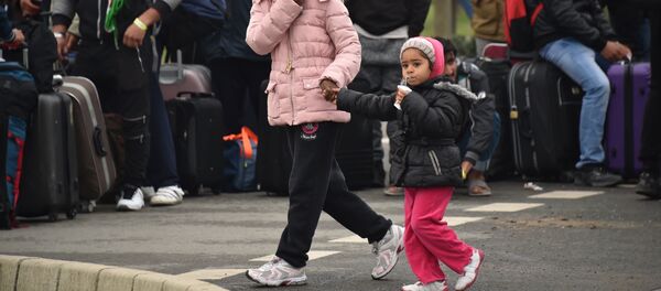 Des migrants - Sputnik Afrique