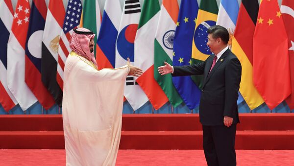 Saudi Arabia's Deputy Crown Prince and Minister of Defense Muhammad bin Salman Al Saud shakes hands with China's President Xi Jinping (R) before the G20 leaders' family photo in Hangzhou on September 4, 2016. - Sputnik Afrique