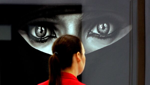 A woman looks at the work Burka by US artist Robert Longo at the booth of the gallery Hans Mayer on April 12, 2011 at the Art Cologne art fair in Cologne, western Germany. Around 200 international galleries will be showcasing Classic Modernism, Post-War and Contemporary art during the fair running until April 17, 2011. - Sputnik Afrique
