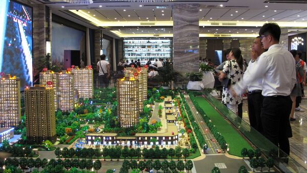 Models of residential buildings are seen at a sales center in Zhengzhou, Henan province, China, September 23, 2016. - Sputnik Afrique