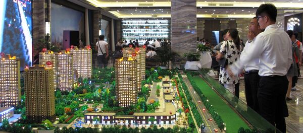 Models of residential buildings are seen at a sales center in Zhengzhou, Henan province, China, September 23, 2016. - Sputnik Afrique