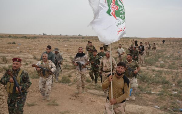 Les soldats turkmènes de Hachd al-Chaabi poursuivent actuellement une offensive dans la région de Geyyara vers leur ville irakienne de Tel Afar, à l'ouest de Mossoul - Sputnik Afrique