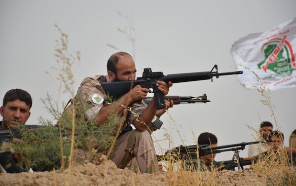 Les soldats turkmènes de Hachd al-Chaabi poursuivent actuellement une offensive dans la région de Geyyara vers leur ville irakienne de Tel Afar, à l'ouest de Mossoul - Sputnik Afrique