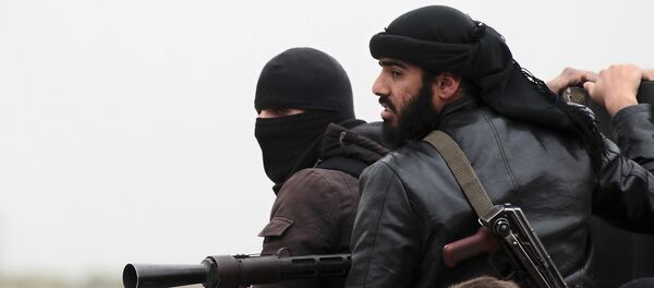 Kämpfer der Terrorgruppe Al-Nusra-Front im syrischen Dorf Aziza (Archivfoto) Kämpfer der Terrorgruppe Al-Nusra-Front im syrischen Dorf Aziza (Archivfoto) - Sputnik Afrique