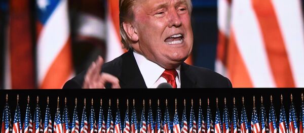 This file photo taken on July 21, 2016 shows US Republican presidential candidate Donald Trump speaks on the last day of the Republican National Convention in Cleveland, Ohio. Donald Trump said on November 9, 2016 he would bind the nation's deep wounds and be a president for all Americans, as he praised his defeated rival Hillary Clinton. - Sputnik Afrique
