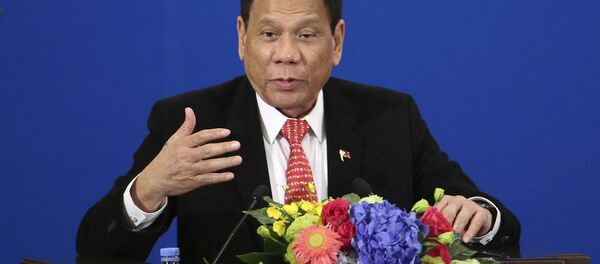 Philippine President Rodrigo Duterte delivers a speech during the Philippines-China Trade and Investment Forum at the Great Hall of the People in Beijing - Sputnik Afrique