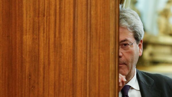 Italian Prime Minister-designate Paolo Gentiloni leaves at the end of a meeting at the Low Chamber in Rome, Italy December 12, 2016. - Sputnik Afrique