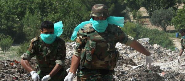 Fosses communes, corps mutilés, mines antipersonnel: le paysage d’Alep-Est libéré - Sputnik Afrique