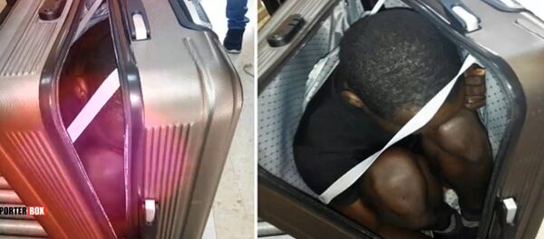 Elle tente de traverser la frontière en cachant un migrant dans une valise - Sputnik Afrique