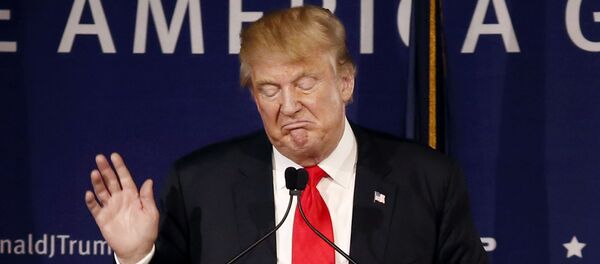 In this Dec. 7, 2015, file photo, Republican presidential candidate, businessman Donald Trump, speaks during a rally coinciding with Pearl Harbor Day at Patriots Point aboard the aircraft carrier USS Yorktown in Mt. Pleasant, S.C. - Sputnik Afrique