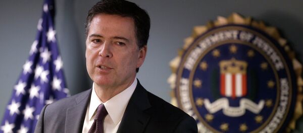 FBI Director James Comey takes questions from members of the media during a news conference, Tuesday, Nov. 18, 2014, in Boston. Comey is visiting the Boston division to meet with employees and law enforcement partners and talk about the FBI's priorities. - Sputnik Afrique