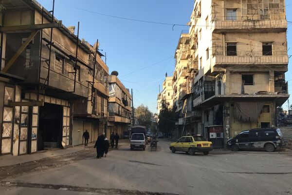 Des résidents du quartier al-Midan à Alep, en Syrie Des résidents du quartier al-Midan à Alep, en Syrie - Sputnik Afrique