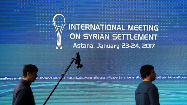 Reporters walk in the media center set for Syria peace talks, in Astana, Kazakhstan, January 23, 2017. - Sputnik Afrique
