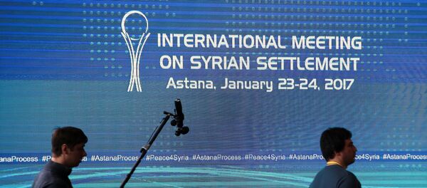 Reporters walk in the media center set for Syria peace talks, in Astana, Kazakhstan, January 23, 2017. - Sputnik Afrique