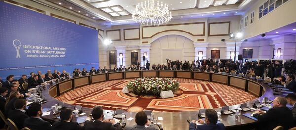 Delegations of Russia, Iran and Turkey hold talks on Syrian peace at a hotel in Astana, Kazakhstan, Monday, Jan. 23, 2017. - Sputnik Afrique