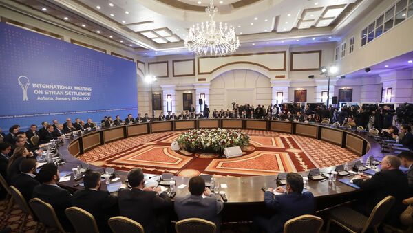 Delegations of Russia, Iran and Turkey hold talks on Syrian peace at a hotel in Astana, Kazakhstan, Monday, Jan. 23, 2017. - Sputnik Afrique