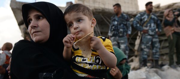 Verteilung russischer Hilfsgüter in Syrien - Sputnik Afrique