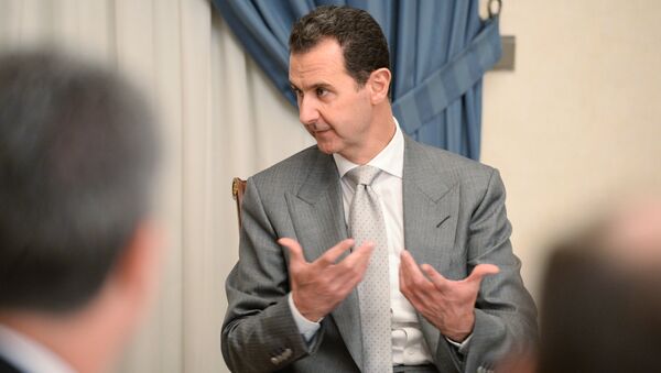Bashar Assad durante um encontro com o vice-chefe do governo russo no início de 2017 em Damasco - Sputnik Afrique