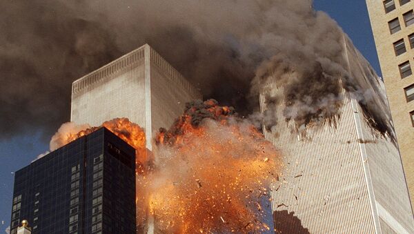 FILE - In this Sept. 11, 2001, file photo, smoke billows from one of the towers of the World Trade Center and flames as debris explodes from the second tower in New York. - Sputnik Afrique