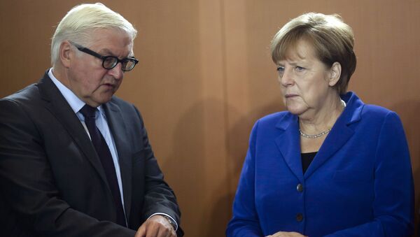 Frank-Walter Steinmeier et Angela Merkel - Sputnik Afrique