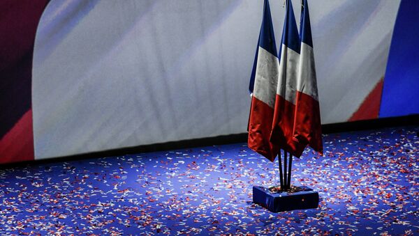 A photo shows French flags on the stage during a rally of the French far-right National Front (FN) party presidential candidate to kick off her campaign in Lyon on February 5, 2017. - Sputnik Afrique