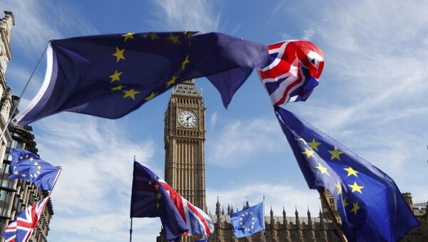 EU and Union flags fly above Parliament Square during a Unite for Europe march, in central London, Britain - Sputnik Afrique