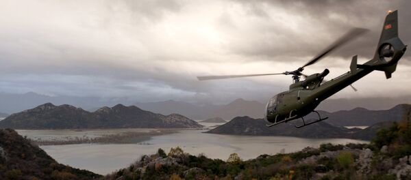 A Montenegro army helicopter flies over flooded land near the Skadar Lake, some 25 kms. south of Montenegro's capital Podgorica A Montenegro army helicopter flies over flooded land near the Skadar Lake, some 25 kms. south of Montenegro's capital Podgorica - Sputnik Afrique