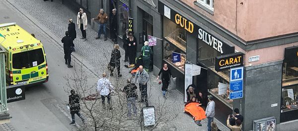 Ambulance in a street near the site were a truck was driven into a crowd in central Stockholm, Sweden - Sputnik Afrique