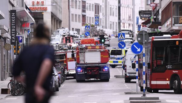 Emergency servies work at the scene where a truck crashed into the Ahlens department store at Drottninggatan in central Stockholm - Sputnik Afrique