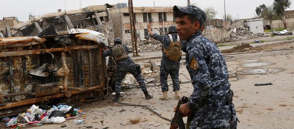 Policier irakien à Mossoul Policier irakien à Mossoul - Sputnik Afrique