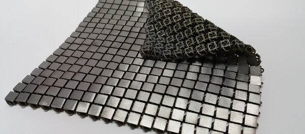 La NASA présente sa «cotte de mailles» spatiale La NASA présente sa «cotte de mailles» spatiale - Sputnik Afrique