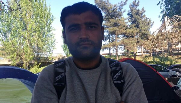 Un migrant de la Porte de la Chapelle - Sputnik Afrique