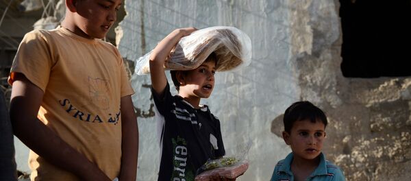 Distribution d'aide humanitaire russe en Syrie - Sputnik Afrique