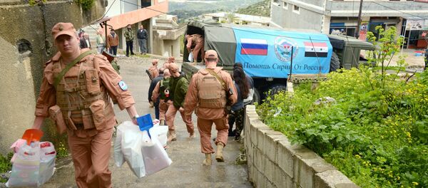 Syrie: 7,9 t d'aide humanitaire russe pour les habitants d'Alep et de Lattaquié - Sputnik Afrique