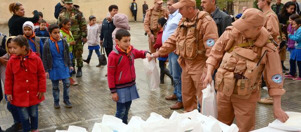 Syrie: 4 t d'aide humanitaire russe pour les habitants d'Alep et de Lattaquié - Sputnik Afrique
