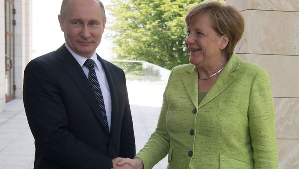 Poutine et Merkel - Sputnik Afrique