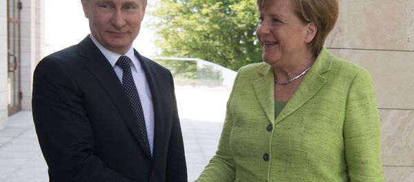 Poutine et Merkel - Sputnik Afrique