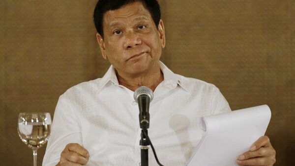 In this Monday, March 13, 2017 file photo, Philippine President Rodrigo Duterte reacts during a press conference at the Malacanang presidential palace in Manila, Philippines. - Sputnik Afrique