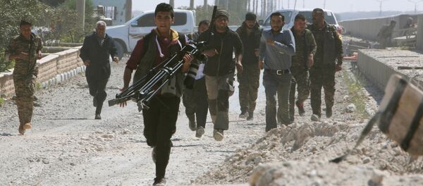 Des combattants des Forces démocratiques syriennes - Sputnik Afrique
