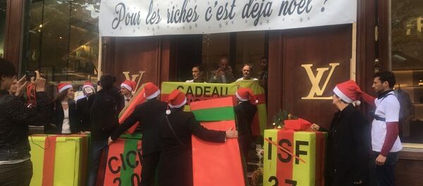 Action ATTAC devant un Louis Vuitton contre Macron 20 Mai 2017, Paris - Sputnik Afrique