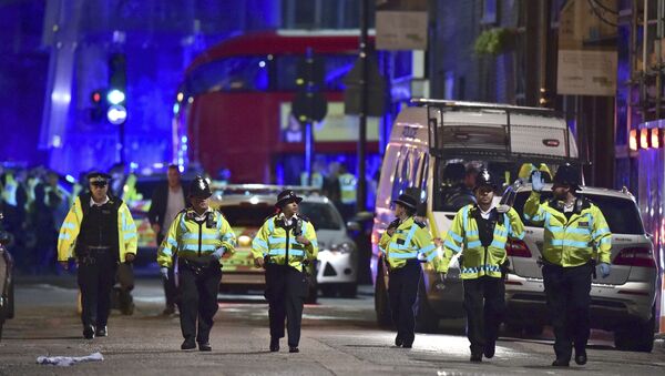 Police officers on Borough High Street as police are dealing with an incident on London Bridge in London, Saturday, June 3, 2017. - Sputnik Afrique