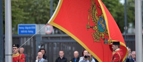 Flag of Montenegro is raised during a ceremony to mark the accession to NATO of Montenegro at NATO headquarters in Brussels, Belgium June 7, 2017. - Sputnik Afrique
