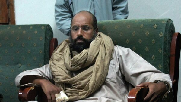 FILE - In this Saturday, Nov. 19, 2011 file photo, Seif al-Islam is seen after his capture in the custody of revolutionary fighters in Zintan. - Sputnik Afrique