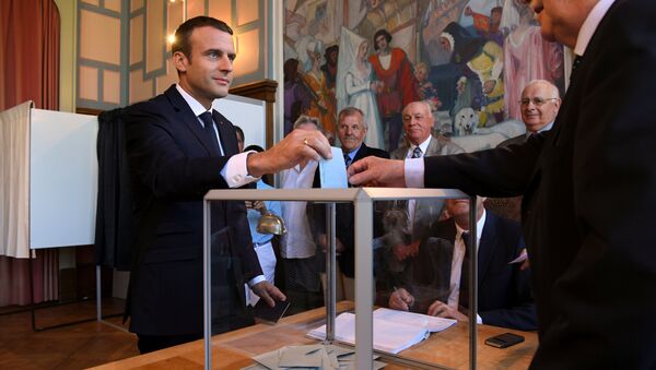 French President Emmanuel Macron casts his ballot as he votes at a polling station - Sputnik Afrique