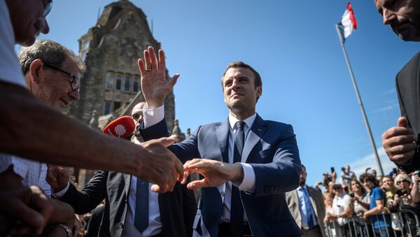 French President Emmanuel Macron leaves the polling station after voting in the first of two rounds of parliamentary elections in Le Touquet, France, June 11, 2017 - Sputnik Afrique