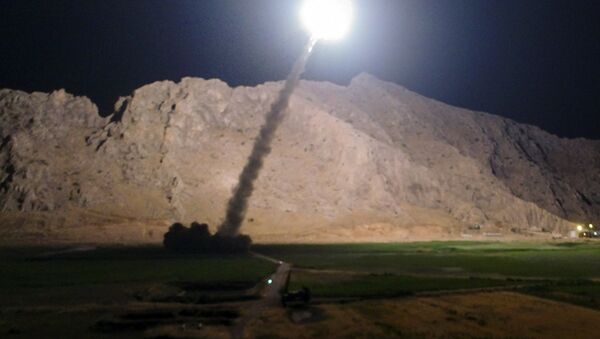 In this picture released by the Iranian state-run IRIB News Agency on Monday, June 19, 2017, a missile is fired from city of Kermanshah in western Iran targeting the Islamic State group in Syria - Sputnik Afrique
