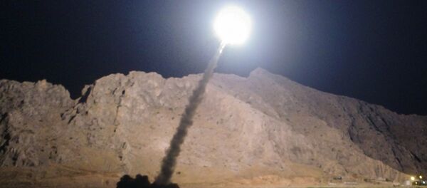 In this picture released by the Iranian state-run IRIB News Agency on Monday, June 19, 2017, a missile is fired from city of Kermanshah in western Iran targeting the Islamic State group in Syria - Sputnik Afrique