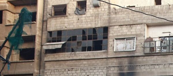 Children play amidst rubble of damaged buildings at Ain Tarma, eastern Damascus suburb of Ghouta, Syria July 17, 2017. Picture taken July 17, 2017. - Sputnik Afrique